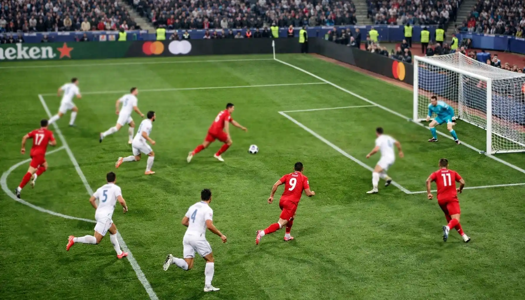 Football team attacking towards goal in fluid movement